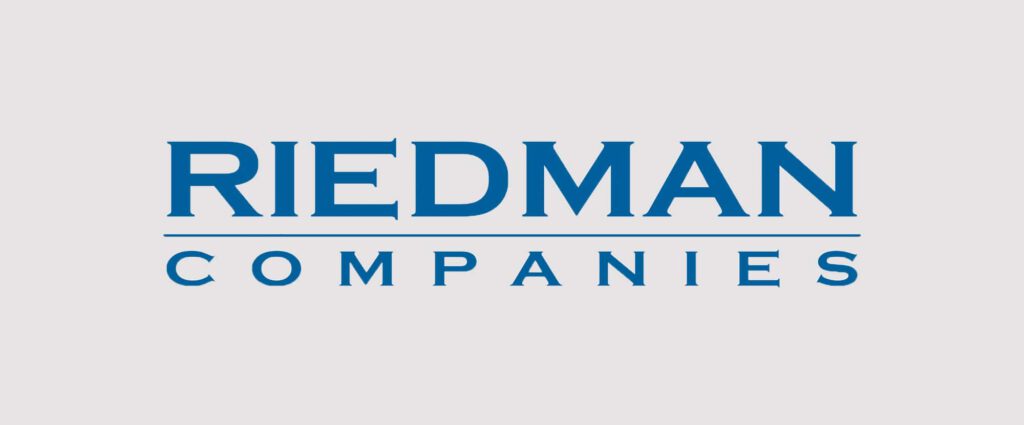 Logo of Riedman Companies, featuring the company name in blue capital letters on a light gray background.