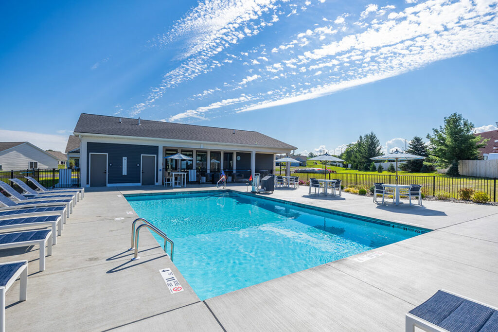 Heated pool with sundeck and pool house at The Hammocks, Geneseo NY