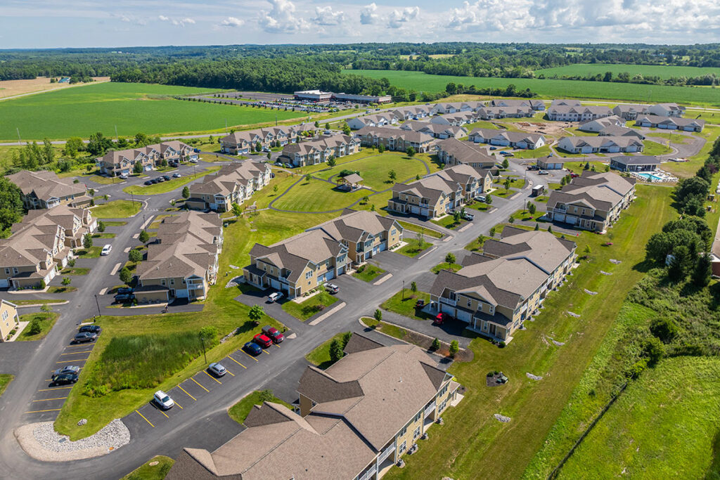 Aerial view of The Hammocks at Geneseo with apartments and new villa homes