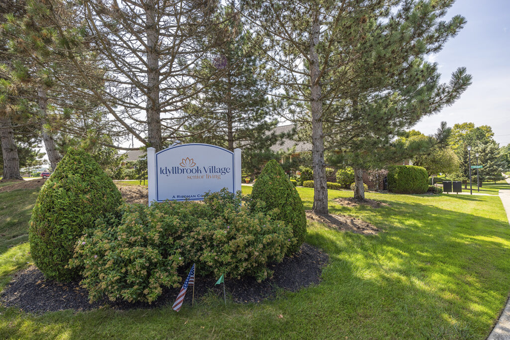 Entrance sign for Idyllbrook Senior Living in Erie, PA, marking the community with a warm and inviting presence.