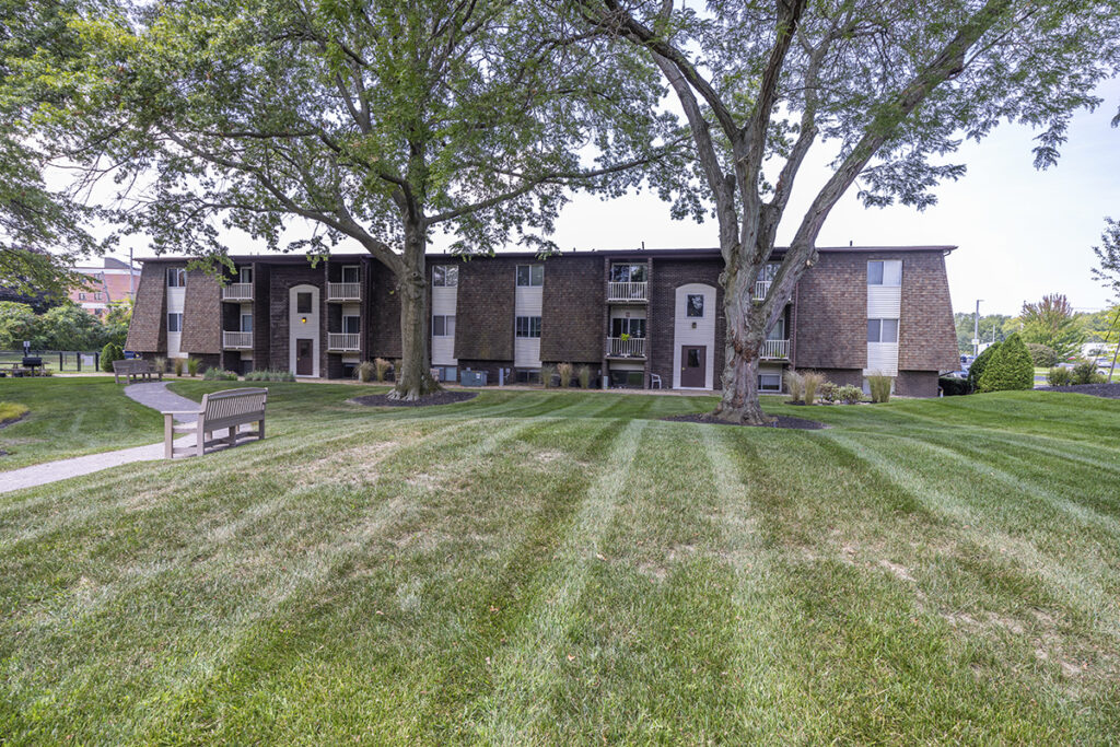 View of the courtyard at Winchester Apartments & Townhomes, showcasing well-maintained landscaping, seating areas, and communal spaces.