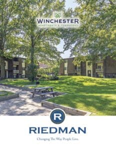 Outdoor view of Winchester Apartments with trees, grassy areas, and picnic benches. Riedman logo and tagline at the bottom.