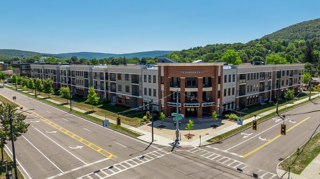 Aerial corner view of 176 Denison East Apartments in Corning NY with a beautiful views of rolling hills, contemporary architecture, and convenient location near downtown.