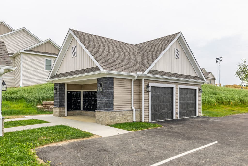 Central mail and refuse area at The Hammocks at Fairview, featuring covered mailboxes, nearby refuse and recycling areas, and easy access for residents within the community.